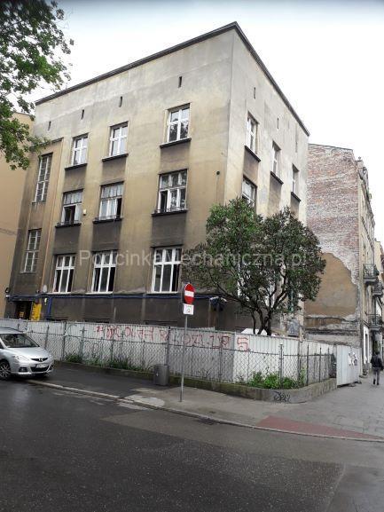 Kamienica Kraków - podcinka muru piłą łańcuchową 