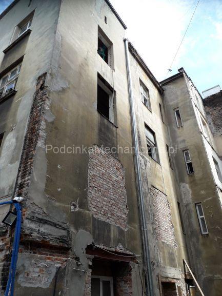 Kamienica Kraków - podcinka muru piłą łańcuchową 