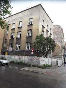 Kamienica Kraków - podcinka muru piłą łańcuchową 